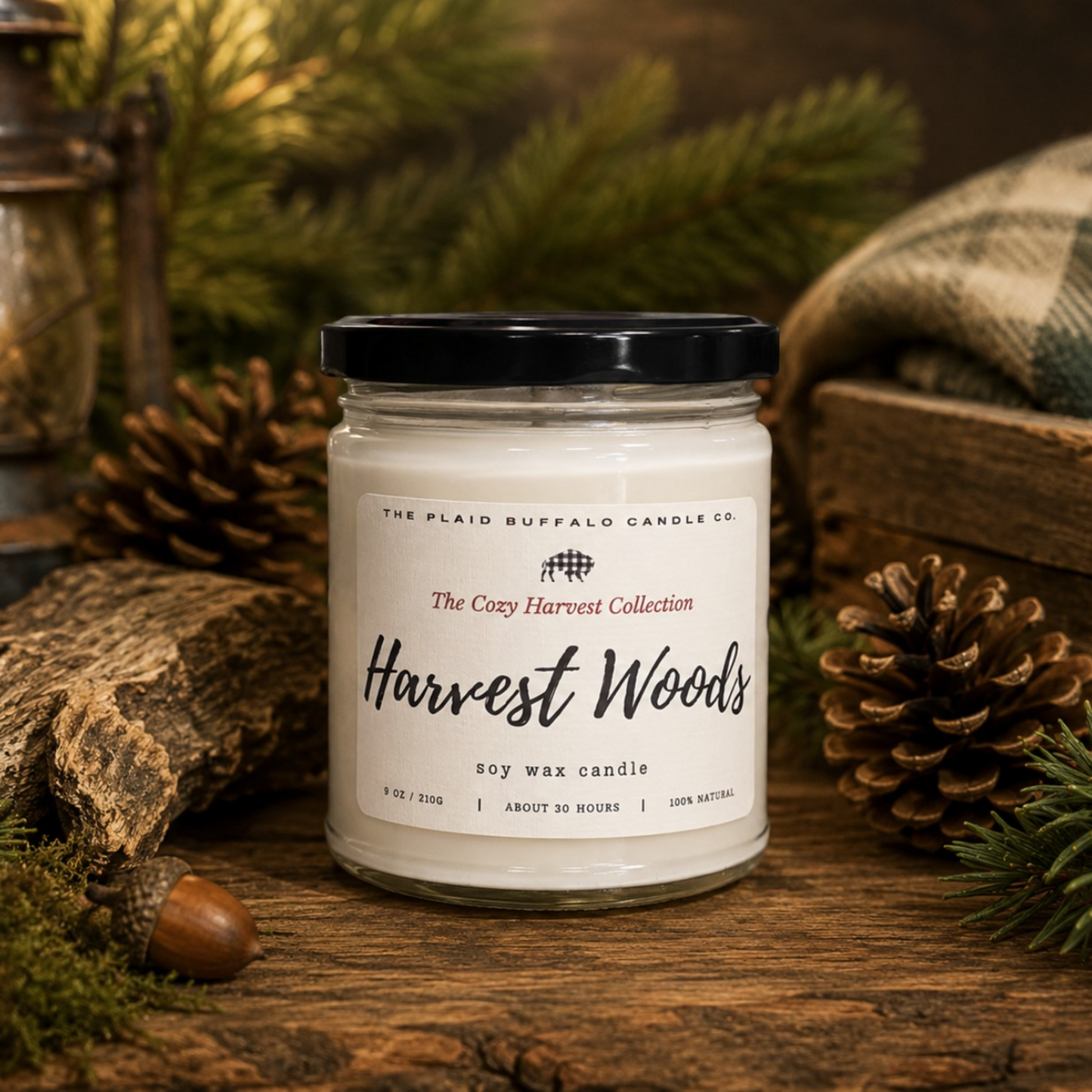 Autumn Leaves soy candle by Plaid Buffalo Candle Co. displayed in a rustic woodland setting with evergreen branches and colorful fallen maple leaves.